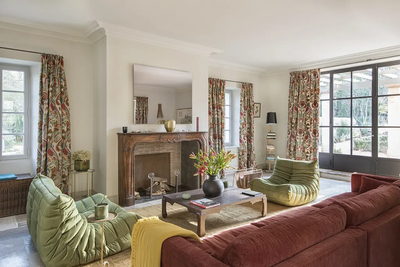 Living room with fireplace at Mas Le Gaudre