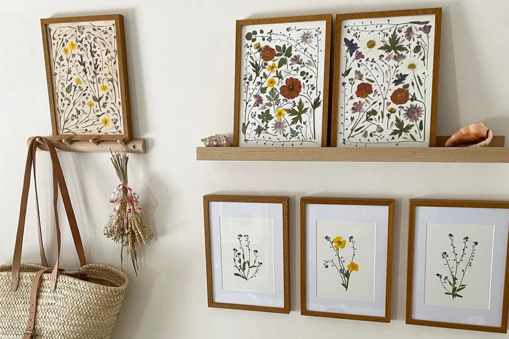 Beth Kendal wildflower prints hanging on a white wall with a wicker basket in view