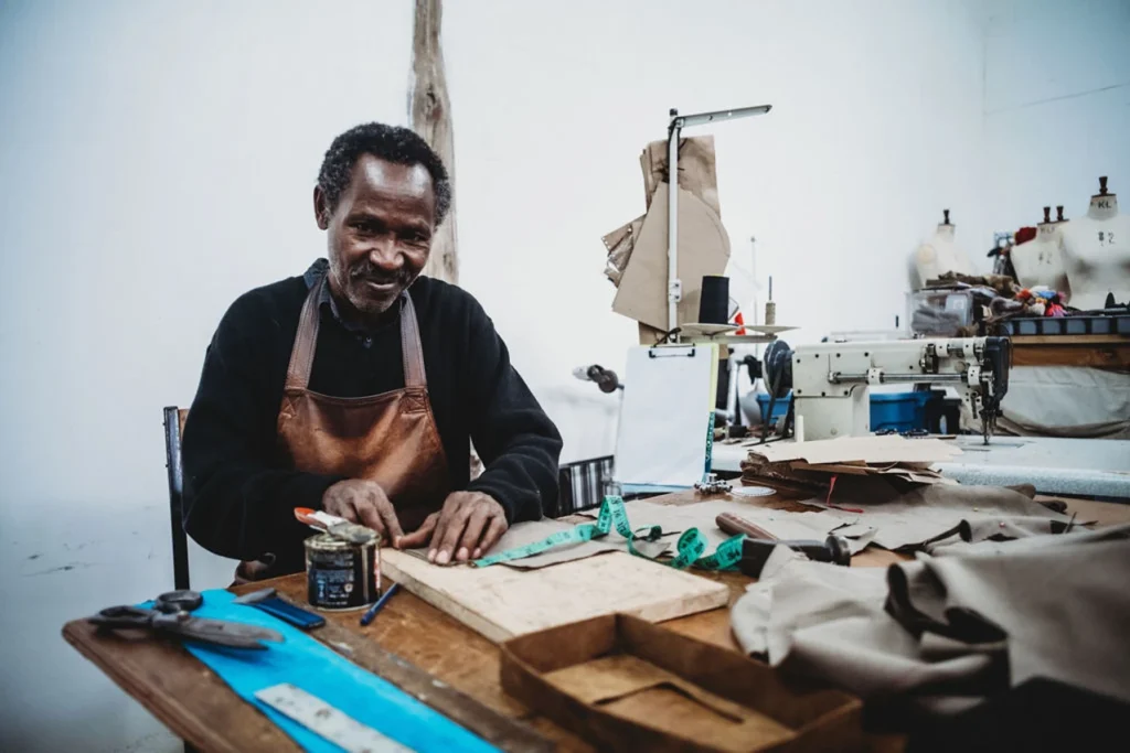 local employee creating anna trzebinski artisanal luxury fashion in the studio