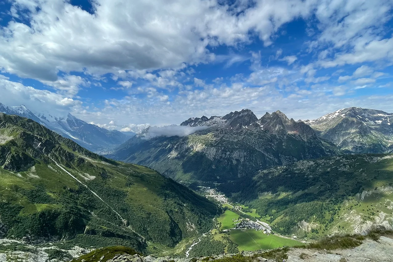 Aerial view of green Alpine valleys and traditional mountain villages on a tailor made Alpine trip