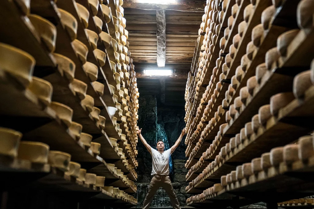 Stefano Lunardi in a cheese aging cellar