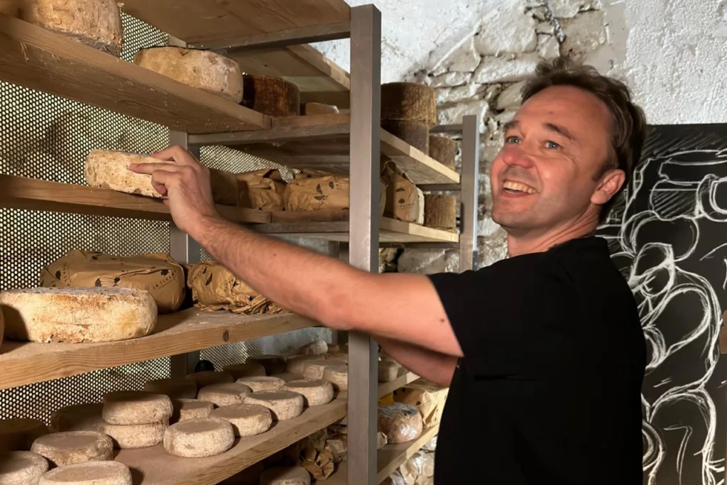Stefano Lunardi in a cheese aging cellar