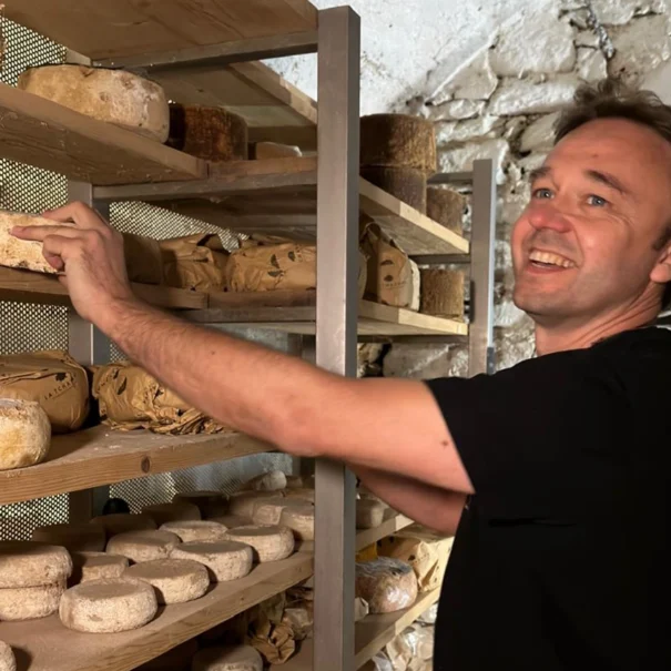 Stefano Lunardi in a cheese aging cellar